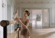 Smiling Girl Holding a Pointe Shoes