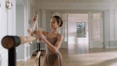 Smiling Girl Holding a Pointe Shoes