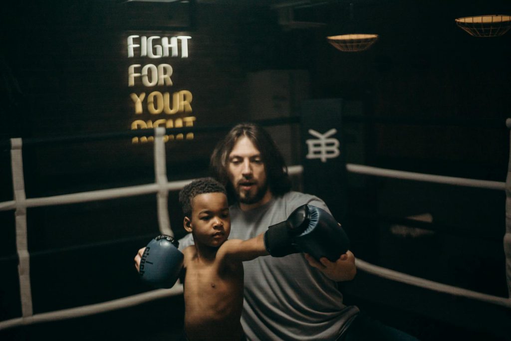 Man in Black Boxing Gloves