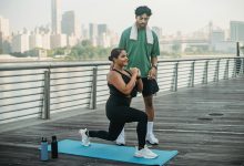 Man in Green Shirt and Black Shorts Doing Push Up